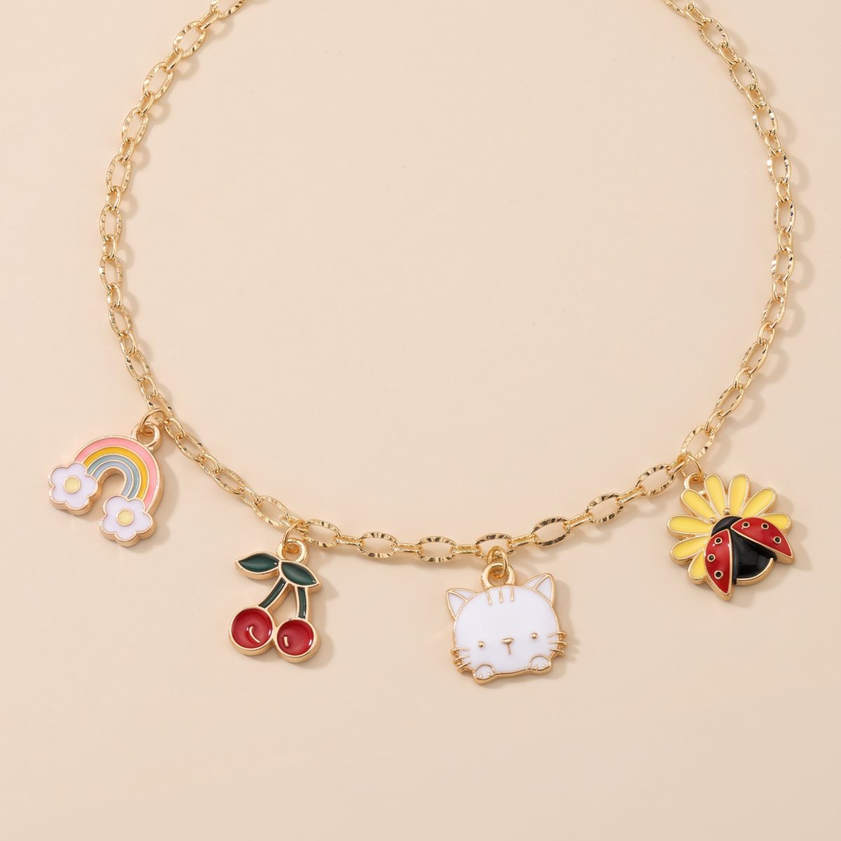 Collier Bibeejoy avec arc-en-ciel, cerises, petit chat et coccinelle